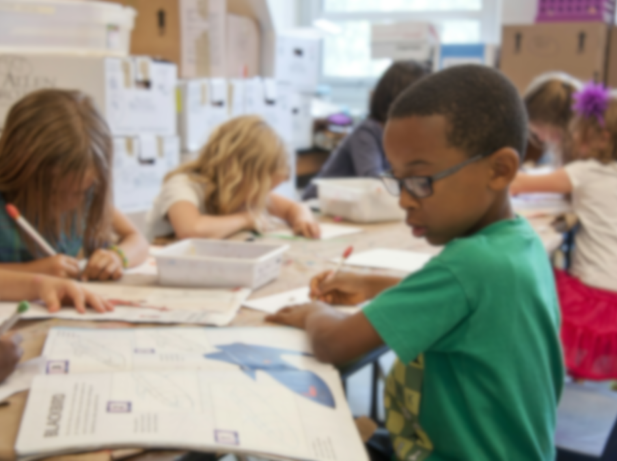 Close-up of students working in a classroom